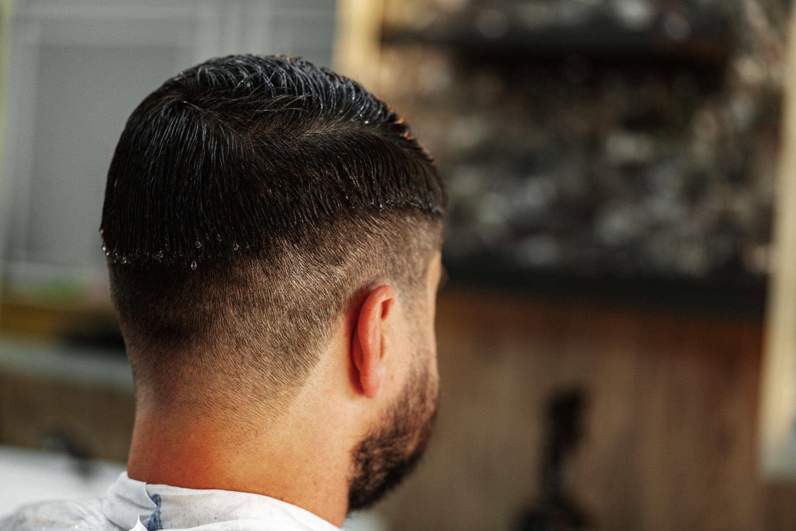 young-man-client-sitting-in-a-barber-shop-2025-02-24-19-08-17-utc (1) (1)